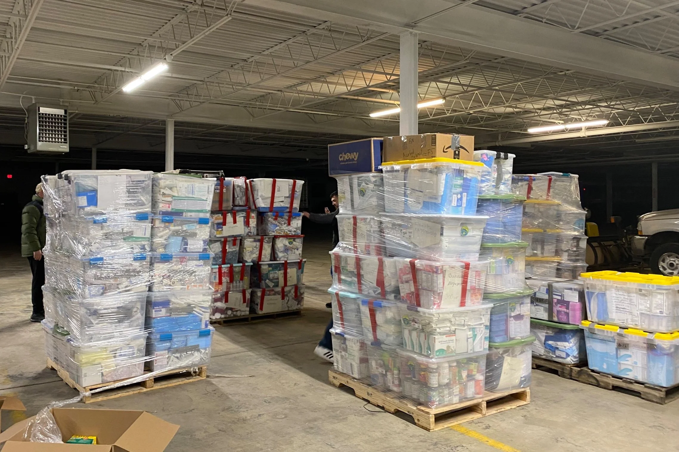 A volunteer moving a pallet of aid onto a truck in Cleveland