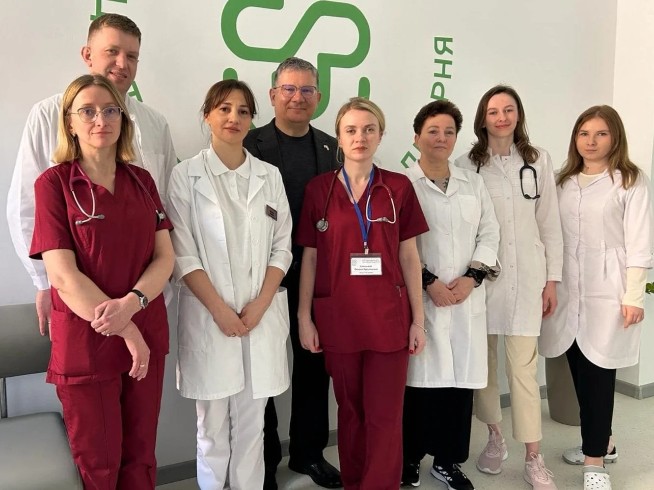 Dr. Taras Mahlay visiting clinicians in a Ukrainian hospital